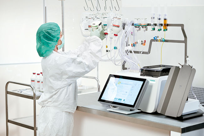 A healthcare professional adjust total parenteral nutrition compounding