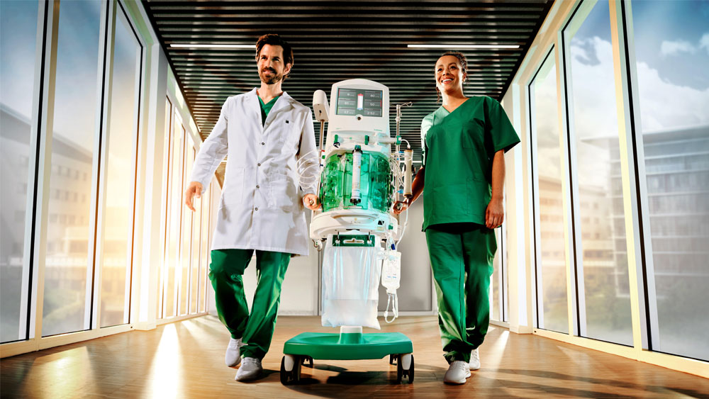 Healthcare professionals transporting the OMNI platform for acute dialysis and blood purification in a hospital corridor